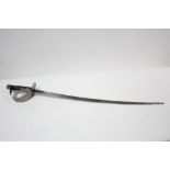 A German Cavalry Officer’s dress sword with 30½” long curved blade & carved treen grip, lacking