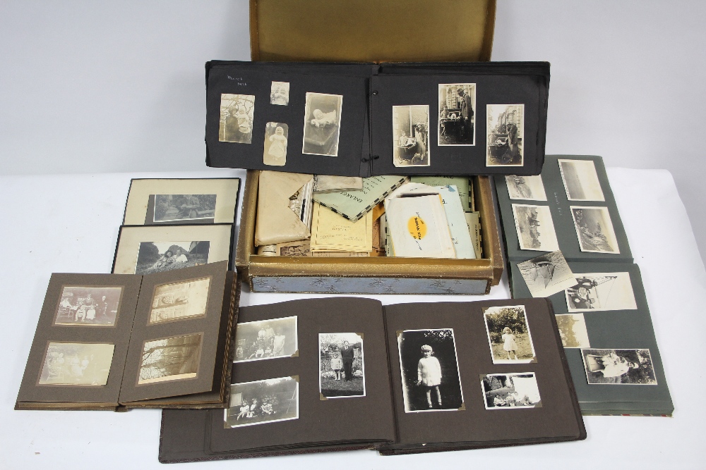 A collection of assorted family photographs contained in five albums, loose, & framed, circa early-