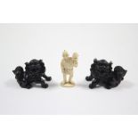 An eastern carved ivory miniature male figure holding a lotus plant, 2” high; & a pair of Chinese