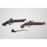 Two replica flintlock pistols in the 17th century style; together with a replica smoker’s pipe.