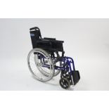 An Invacare "Action 2000" folding wheelchair.