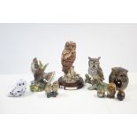 A Royal Doulton "Tawny Owl" ornament on wooden plinth, together with seven other owl ornaments, &