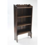 A small oak standing four-tier open bookcase, 24” wide x 48” high.
