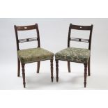 A pair of 19th century mahogany bow-back dining chairs with padded seats & on ring-turned tapered