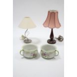 A pair of Grimwades floral decorated chamber pots; & two table lamps, each with shade.