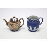 A Royal Doulton stoneware globular teapot of deep blue & buff ground & with raised floral
