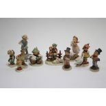 Three Goebel Hummel figures titled “I Brought You a Gift”, “Heavenly Angel”, & “Little Gardener”;