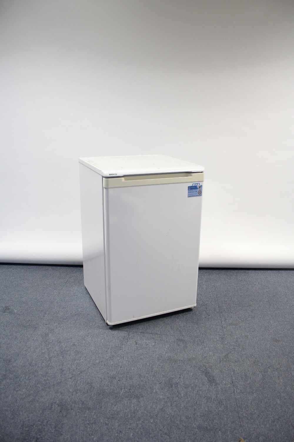 A Beko under-counter refrigerator in white-finish case, w.o.