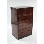 A mahogany small upright chest fitted two short & three long graduated drawers with cast-metal