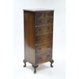 A reproduction burr-walnut narrow upright chest fitted two short & five long graduated drawers