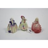 Three Royal Doulton bone china figures “Babie” (HN 1679), “Dinky Do” (HN 1678), & “Rose” (HN 1368).