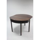 A late 19th/early 20th century mahogany drop-leaf side table on four square chamfered legs, 41¼"