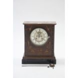 A late 19th/early 20th century 8-day mantel clock with white enamel two-part dial, striking movement