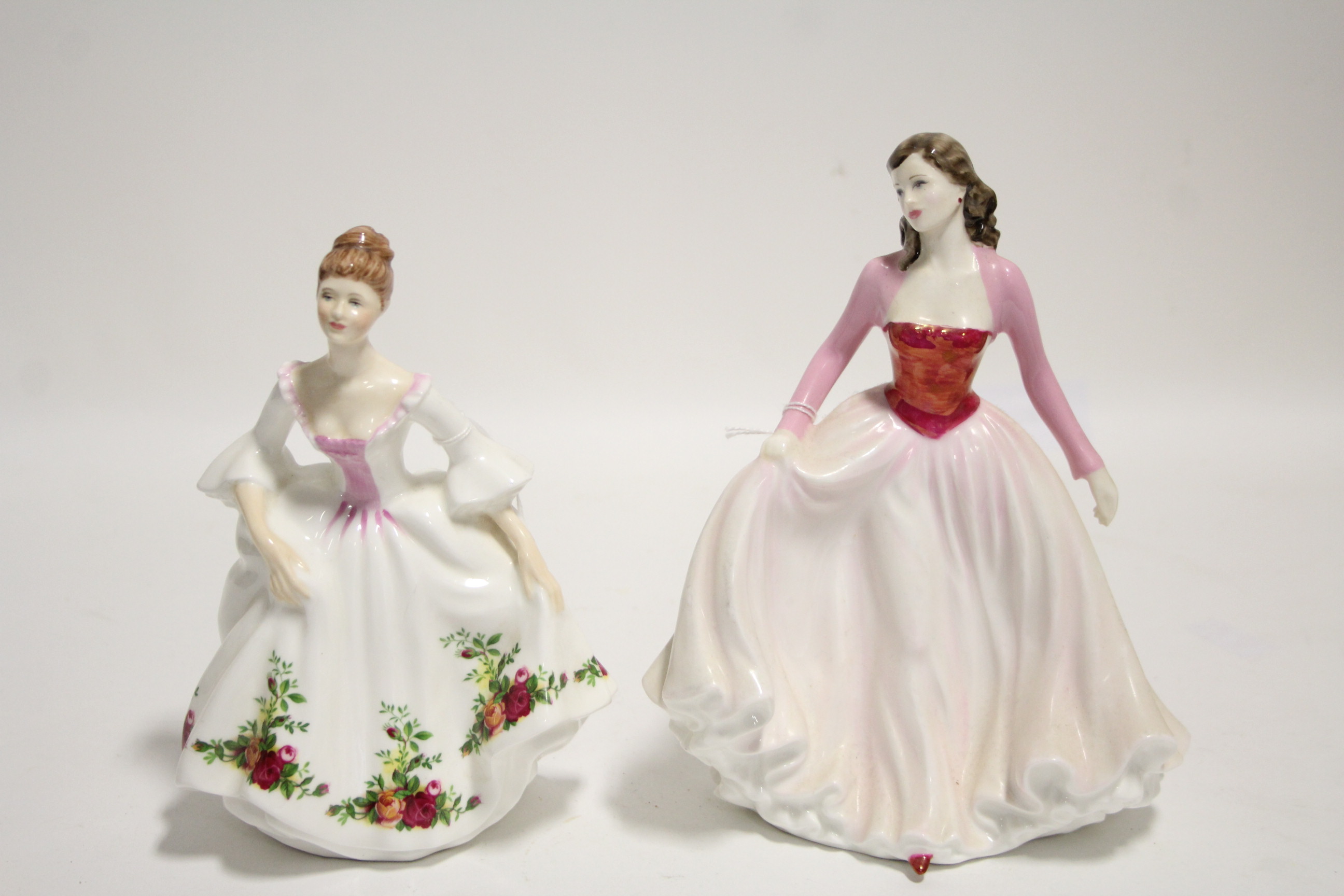 Two Royal Doulton bone china figures “Country Rose” (HN 3221), & “Happy Anniversary Pink”, (HN