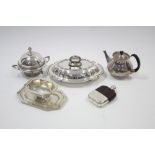 Five various items of electro platedware comprising a circular teapot, an entrée dish, a muffin