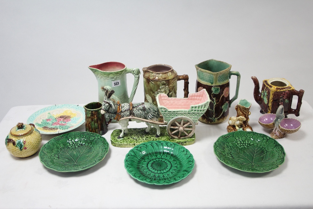 Ten various items of Majolica ware including jugs, figures, etc., part w.a.f.
