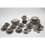 A brown & grey glazed pottery thirty-five piece part dinner & coffee service.