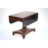 A William IV rosewood drop-leaf supper table fitted end drawer, on baluster turned centre column &