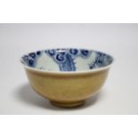 An early 18th century Chinese porcelain deep bowl, the interior painted with a dragon chasing the