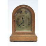An early 20th century chiming mantel clock with German three-train movement & engraved brass