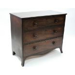 An early 19th century inlaid mahogany chest fitted three long graduated drawers with turned knob