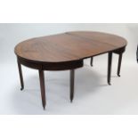 A late 18th century mahogany dining table with D-shaped ends & centre leaf, on square tapered legs