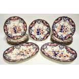 Eleven Bloor Derby "Imari" pattern 10" dinner plates with gadrooned rims (one riveted); & a pair