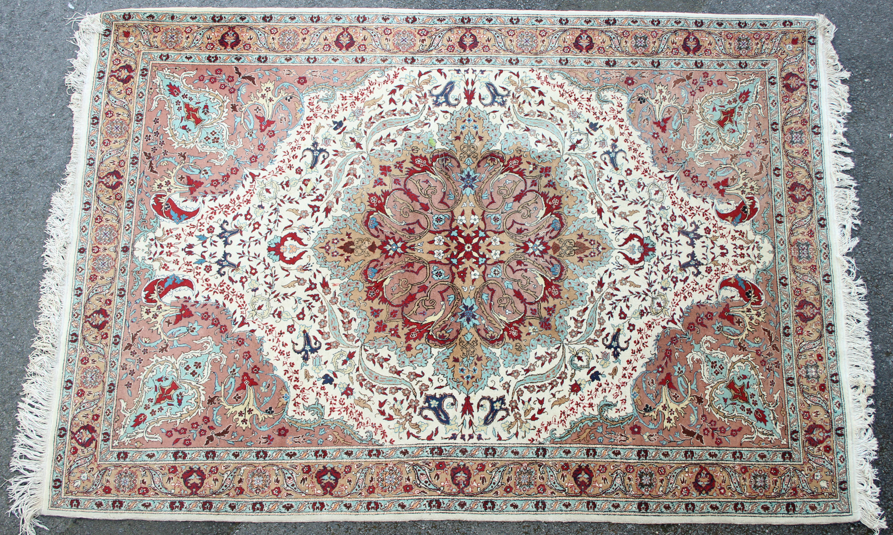 A modern Persian carpet of ivory ground, with centre medallion & all-over multicoloured floral