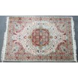 A modern Persian carpet of ivory ground, with centre medallion & all-over multicoloured floral