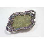 A green onyx shaped oval tray with champlevé enamel wide border & side handles, the gilt-brass