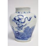 A CHINESE BLUE & WHITE PORCELAIN BALUSTER VASE, boldly painted with a male figure standing above a