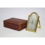 A 1930's travelling timepiece with eight-day alarm movement, in rectangular gilt metal case with