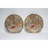 A pair of Japanese Satsuma-type pottery shallow dishes decorated with figure scenes; 12½" diam.