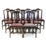 A SET OF TWENTY FOUR HEPPLEWHITE STYLE MAHOGANY DINING CHAIRS with arched top-rails & pierced