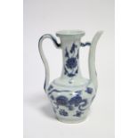 A Chinese blue & white porcelain ewer with tall narrow neck & long curved spout, painted with lion-