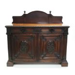 A Victorian oak small sideboard with low raised back & egg-&-dart borders, fitted two shallow frieze