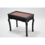 A late 19th century Chinese carved hardwood low rectangular occasional table inset rouge marble