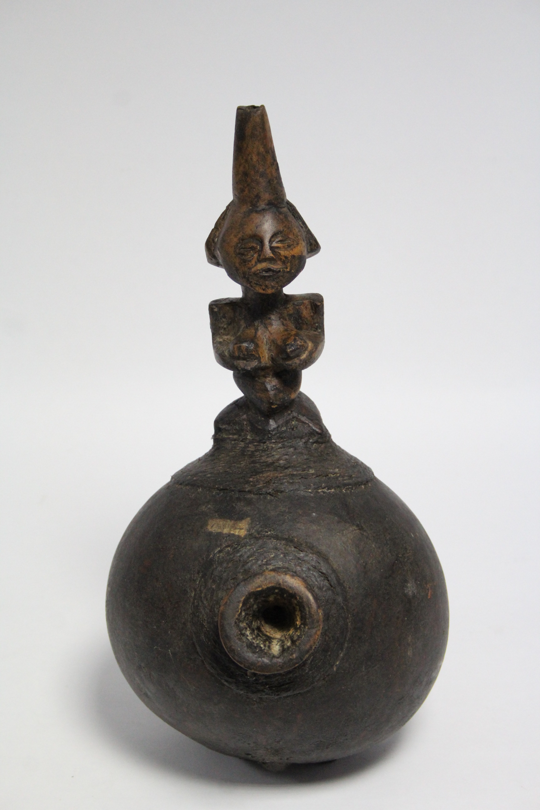 An African smoking pipe with short bowl to the round gourd body, with carved figural handle, - Image 2 of 2