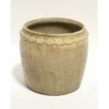 An early Vietnamese cylindrical vase with all-over crackled cream glaze, a border of leaves to the