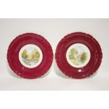 A pair of Royal Crown Derby dessert plates with wide claret borders, the centres with painted