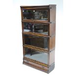 A Globe-Wernicke type mahogany four-tier sectional bookcase each tier enclosed by glazed door and