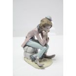 A Lladro porcelain large figure titled: “Clown Thinking”.