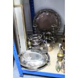 A silver plated engraved oval entrée dish; a pair of plated candlesticks; a pair of plated