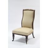 A 19th century simulated rosewood frame nursing chair with padded back & sprung seat, & on short