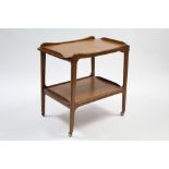 A teak rectangular two-tier tea trolley on square tapered legs with castors, 28” wide x 27” high.