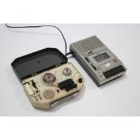 A Benkson “De-Luxe 77” portable reel-to-reel tape recorder; together with another tape recorder; & a