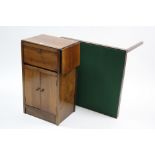 A walnut & plywood small drop-leaf side cabinet enclosed by fall-front above cupboard enclosed by