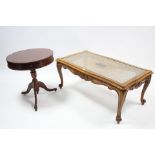 A carved walnut rectangular low coffee table on slender cabriole legs and inset plate glass top, 39½