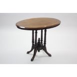 A late 19th century inlaid mahogany oval occasional table on four turned & carved legs, 33½" x