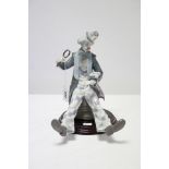 A Lladro porcelain large clown figure titled: “Checking the Time” (No. 5762), with stand.